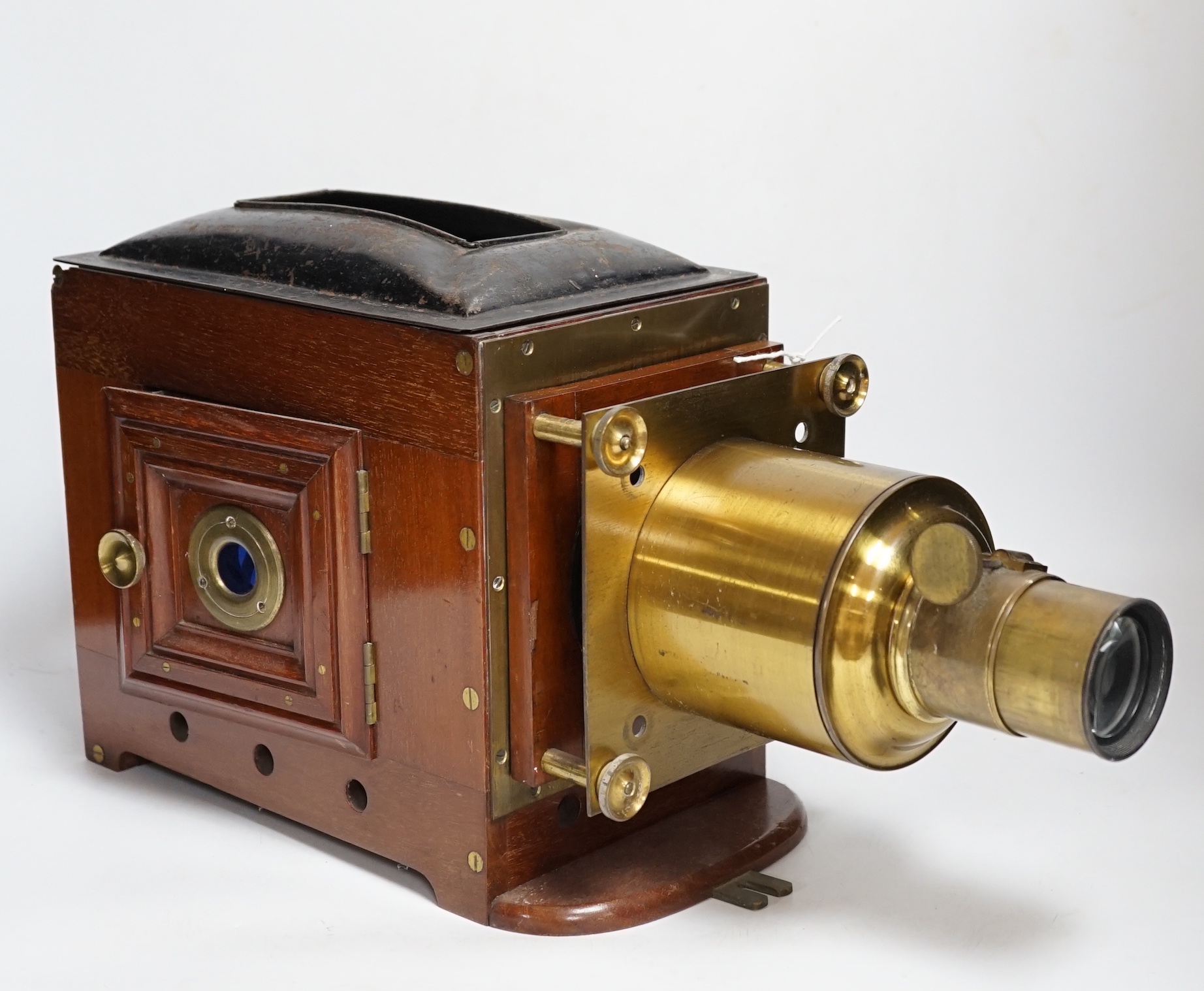 A late Victorian brass mounted mahogany magic lantern by Dunscombe, Bristol with a small quantity of slides (converted to electricity)